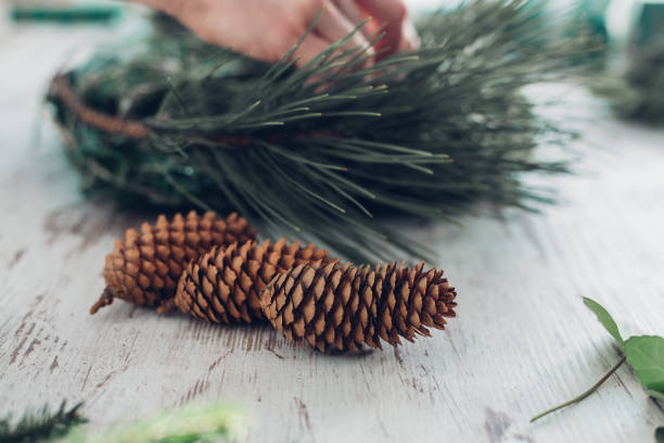istock Woman Making A Christmas Wreath 1341452187