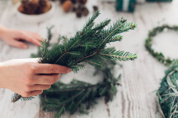 istock Woman Making A Christmas Wreath 1341452502