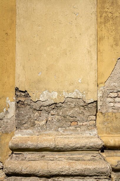 istock Old plastered street wall 1341453185