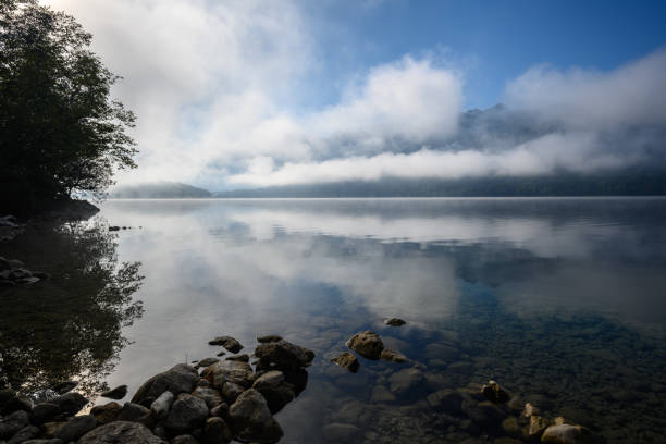 istock Early morning fog on a lake 1341455732