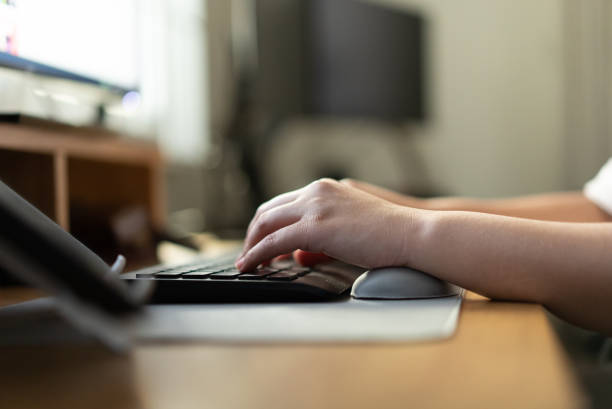 istock Close up of human hand working typing on computer keyboard 1341456156