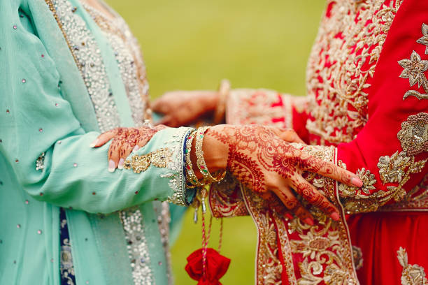 istock hindu bride walks behind husband holding garb 1341459086