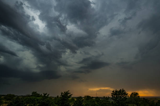istock Swirling, threatening gray storm clouds filling sky 1341459111