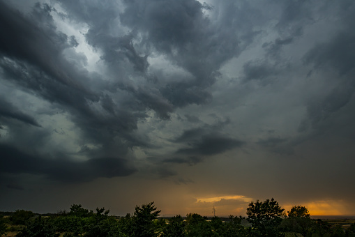 Stormy cloudy sky dramatic dangerous dark gray cloudscape.