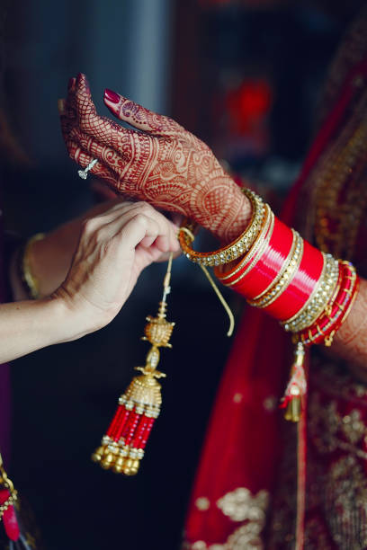 istock hindu bride walks behind husband holding garb 1341459148