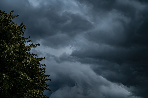 Stormy cloudy sky dramatic dangerous dark gray cloudscape.