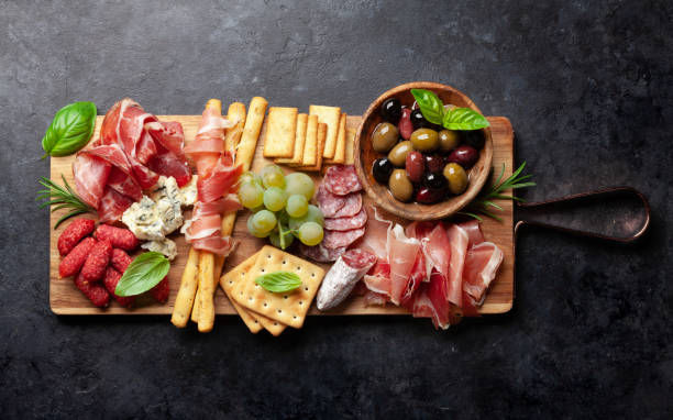istock Antipasto with prosciutto, salami, crackers, cheese and olives 1341460059