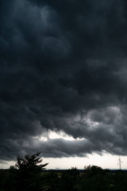 Swirling, threatening gray storm clouds filling sky