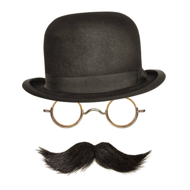 Bowler hat with black curly moustache and glasses isolated on white Vintage bowler hat with black curly moustache and glasses isolated on a white background mustache stock pictures, royalty-free photos & images