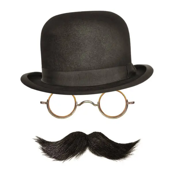 Photo of Bowler hat with black curly moustache and glasses isolated on white