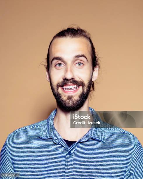 Portrait Of Smiling Bearded Man Stock Photo - Download Image Now - Dental Braces, Men, Only Men