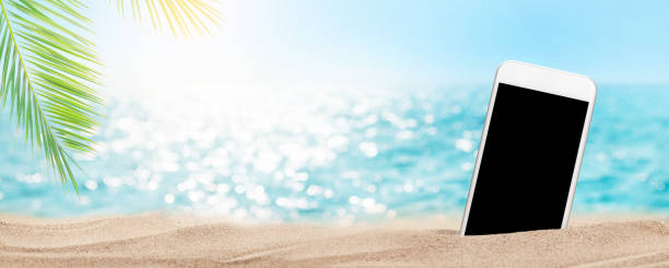 istock Smartphone on tropical sea beach 1341462178
