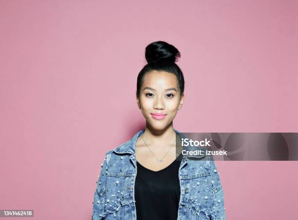 Smiling Young Woman Against Pink Background Stock Photo - Download Image Now - Only Women, Women, 20-29 Years