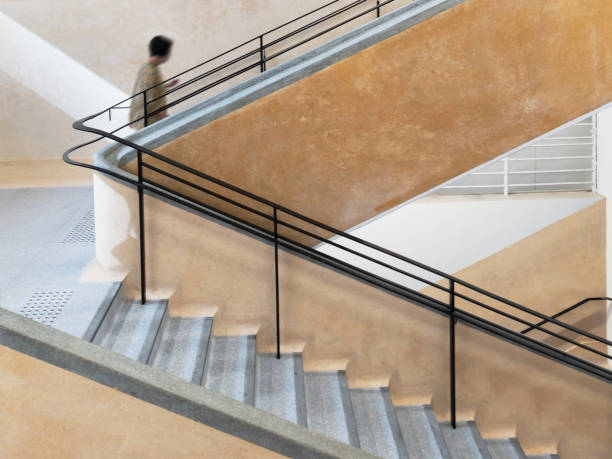 istock Interior view of a unrecognized people walking upstairs 1341462614
