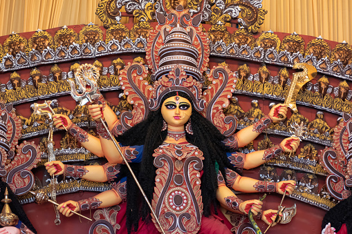 Goddess Durga idol decorated at puja pandal in Kolkata, West Bengal, India. Durga Puja is biggest religious festival of Hinduism and is now celebrated worldwide.