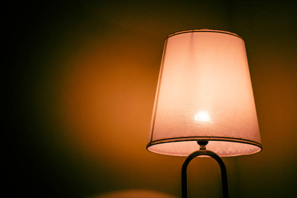 istock table lamp for the bedroom. warm light. close-up 1341463862