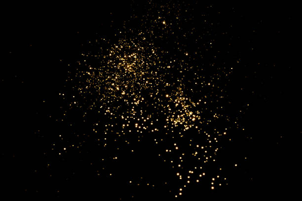 istock Golden blurred bokeh lights on black background 1341465278
