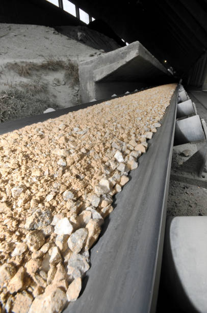 istock conveyor belt with stones in construction factory 1341466313
