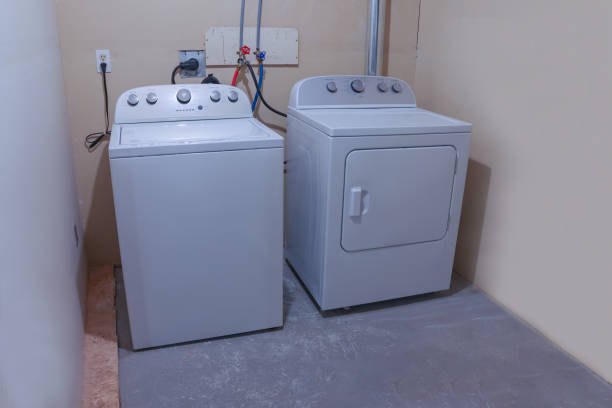 istock Side view of a laundry room high efficiency washer and dryer. 1341469314