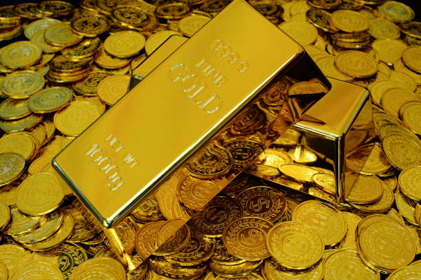 Gold bullion on pile golden coins a lot of Gold bullion on pile golden coins a lot of gold medal stock pictures, royalty-free photos & images
