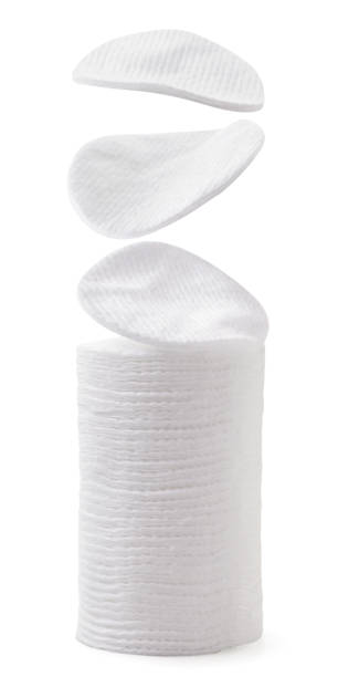 Cotton pads fall on the pile on a white background. Isolated