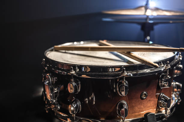 istock Part of a drum kit, snare drum on a dark background. 1341474092