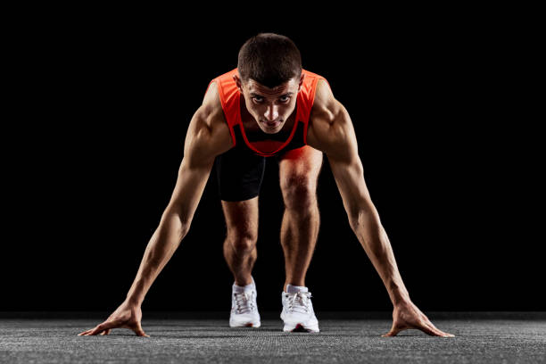 istock Young man, male athlete training isolated over black studio background 1341474129
