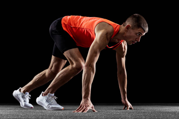istock Young man, male athlete training isolated over black studio background. Side view 1341474130