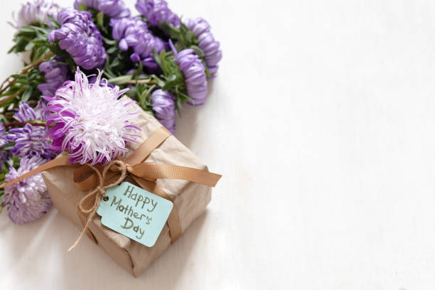 istock Gift box with a wish for a happy mother's day on a white background, copy space. 1341477294