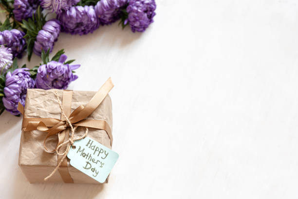 istock Gift box with a wish for a happy mother's day on a white background, copy space. 1341477297