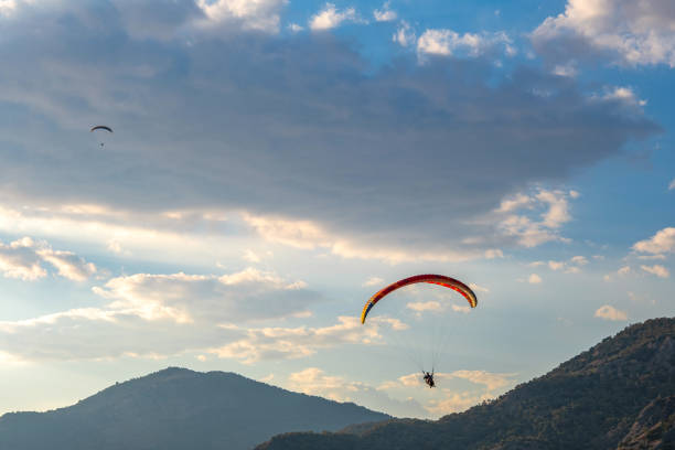istock Paragliding among the mountains 1341477893