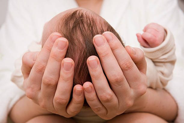 istock Mother holding her newborn son 134148068