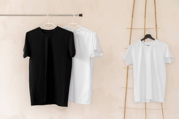 istock White and black T-shirts on hangers for design presentation 1341481080