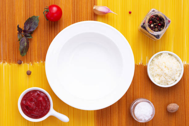 istock Pasta spaghetti food and plate as background. Raw pasta spaghetti 1341481181