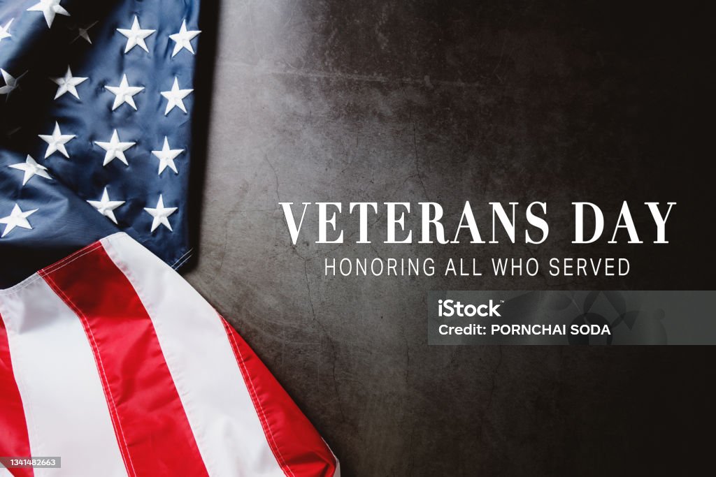 Veterans day. Honoring all who served. American flag on gray background with copy space. US Veteran's Day Stock Photo