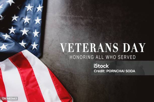 Veterans Day Honoring All Who Served American Flag On Gray Background With Copy Space Stock Photo - Download Image Now