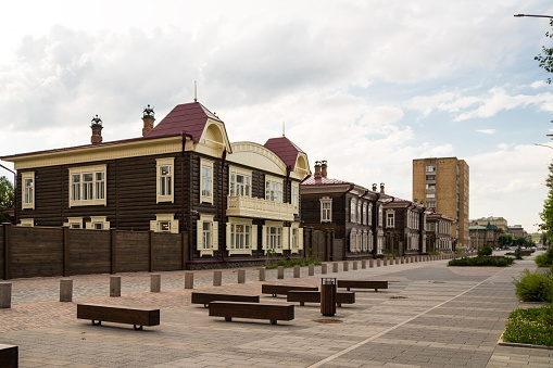 Restored wooden houses, buildings of the turn of the XIX - XX centuries on the Historical pedestrian zone of Gorky Street, the city of Krasnoyarsk, Russia.