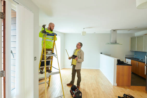 contractor and landlord making final repairs