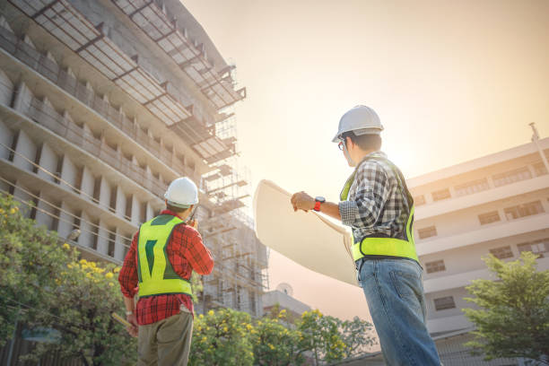 istock engineers discussion with consultants about detail of building at construction site. 1341484792