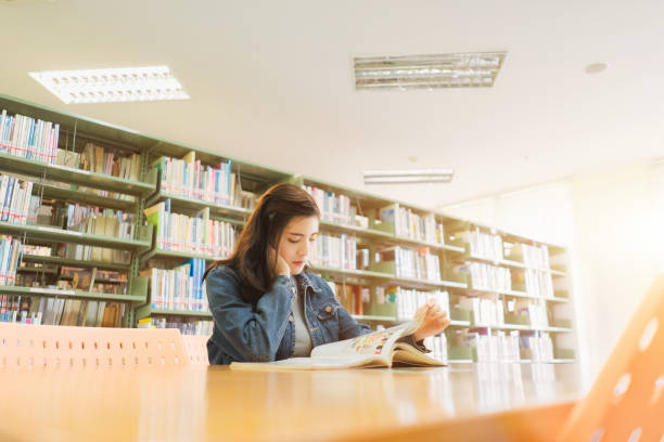 asian student was reading and research in the library or study lessons for exam. - concentration teacher business copy space imagens e fotografias de stock