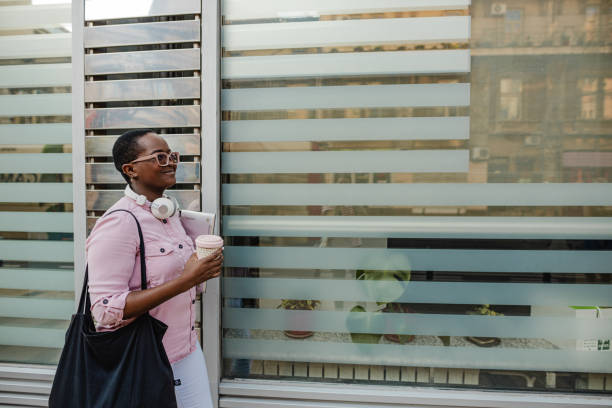 istock Young African-American woman walks 1341489706