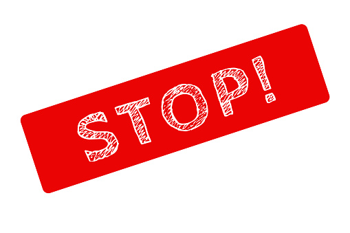 Sign with the word stop in red color