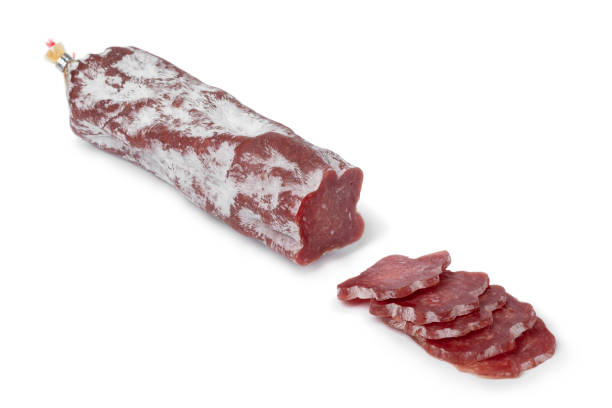 istock Sliced Saint Agaune sausage, a French pork saucisson, on white background 1341490655