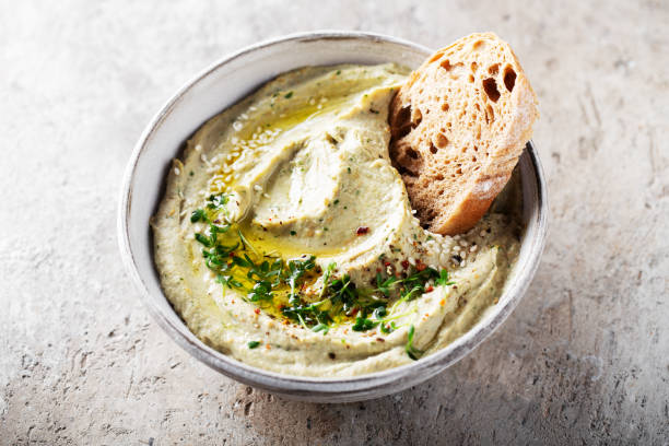 baba ghanoush, babaganoush or eggplant hummus on the bowl with bread, traditional middle eastern cuisine - eggplant dip baba ghanoush middle eastern cuisine imagens e fotografias de stock