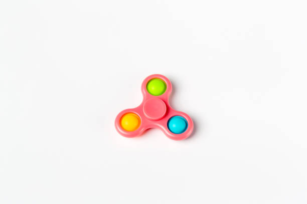 istock Fidget spinner stress relieving toy on white  background. hand toy known as hand spinner it is very popular 1341496355