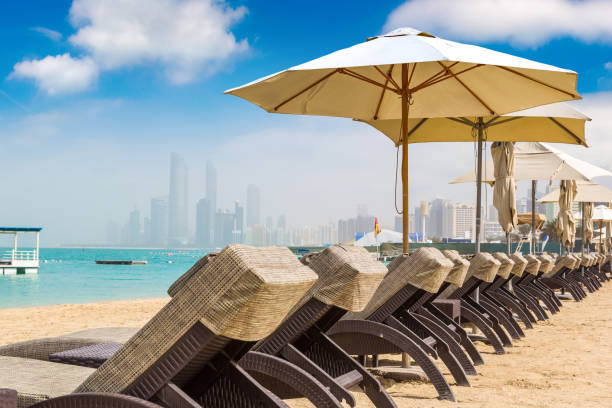 istock Sunbeds at the beach in Abu Dhabi 1341497383