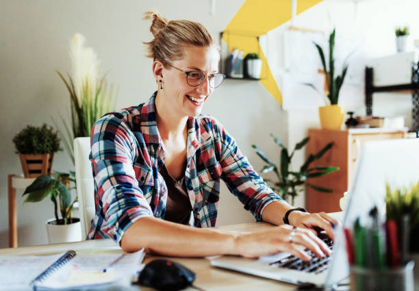 istock Adult woman working from home, using laptop 1341501364