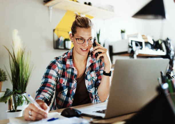 istock Adult woman working from home, using laptop 1341501443