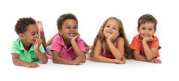 istock Happy kids lying on the floor 1341501463