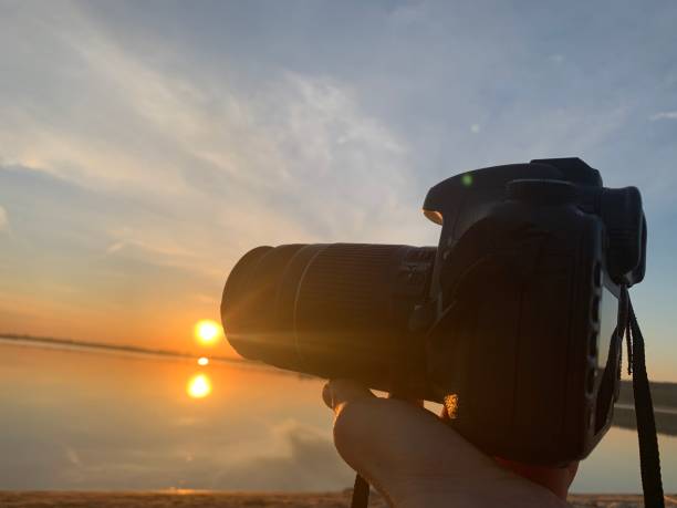 istock Taking photos of sunset 1341501625